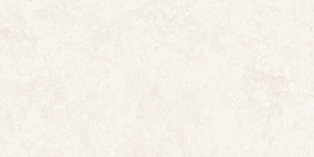 A close-up of a light warm off-white textured surface, resembling stone, concrete, or plaster.